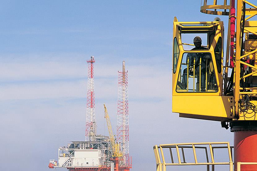 oil rig control room with rig in frame